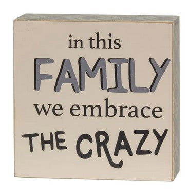 Family Embraces Crazy Box Sign